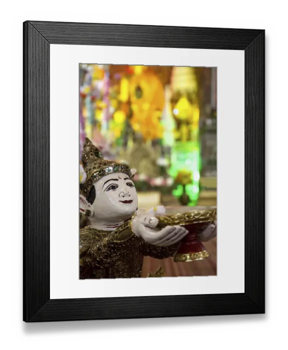 Framed Print : Buddhist angel holding a bowl of coins