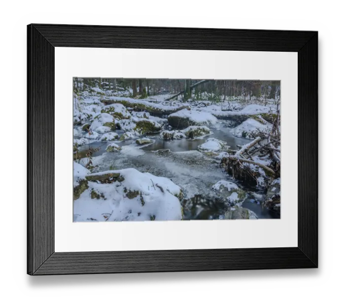 Framed Print : A stream flows through the forest