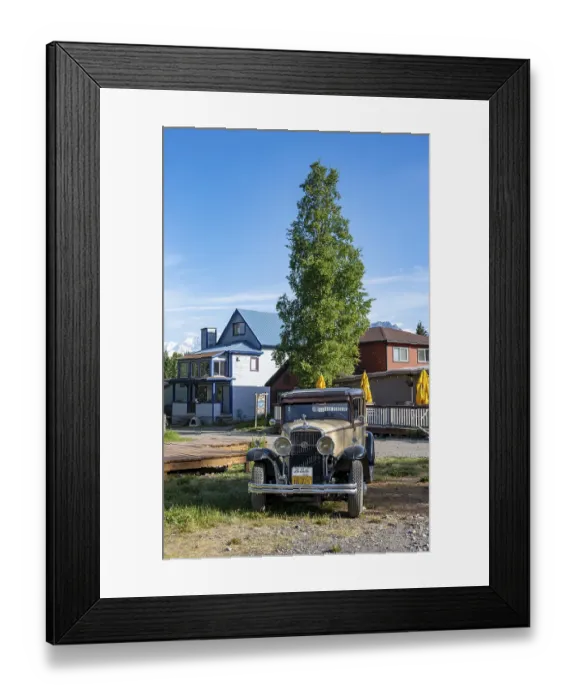 Framed Print : Vintage car and historic building