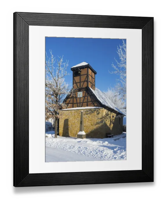Framed Print : Timbered church in snowcoat with clear blue sky in background