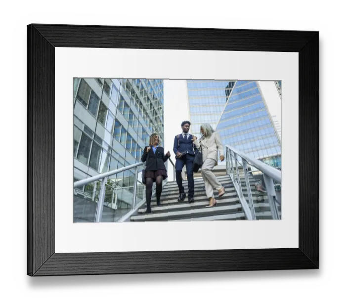 Framed Print : Diverse business colleagues descend outdoor stairs in a modern financial district