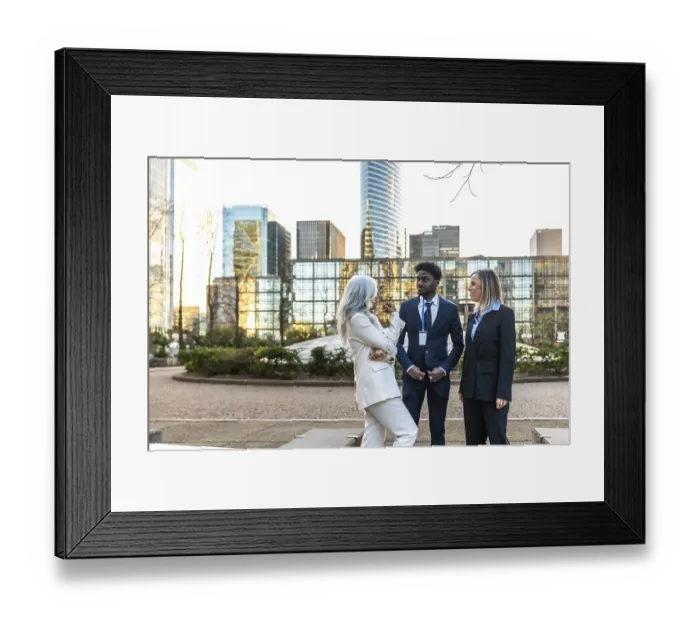 Framed Print : Diverse business professionals conducting an informal meeting