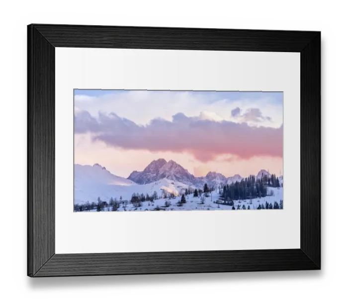 Framed Print : Sunset with dramatic sky and snowy mountain peaks illuminated by sunlight Framed Print : Sunset with dramatic sky and snowy mountain peaks illuminated by sunlight
