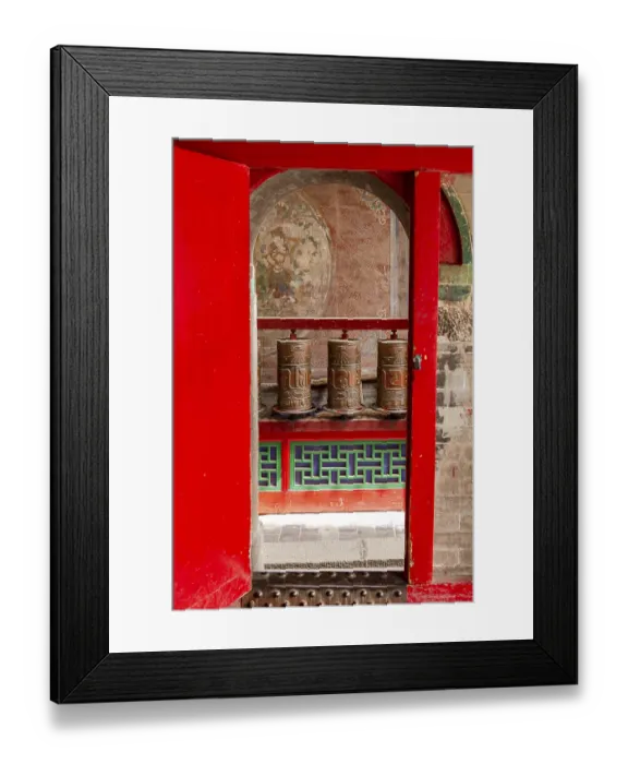 Framed Print : Prayer wheels behind a gate in a Tibetan temple of the Kumbum Jampaling monastery complex in Xining Framed Print : Prayer wheels behind a gate in a Tibetan temple of the Kumbum Jampaling monastery complex in Xining