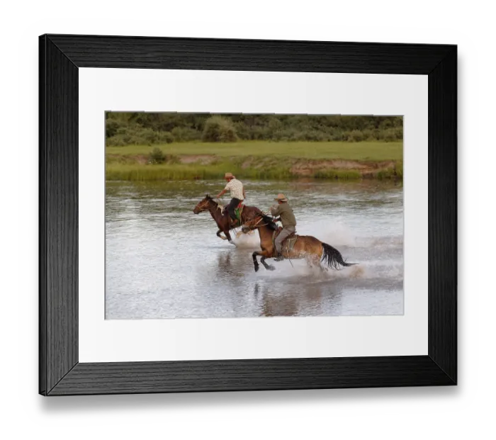 Framed Print : Young Mongolian horseman rides at full gallop on the river Framed Print : Young Mongolian horseman rides at full gallop on the river