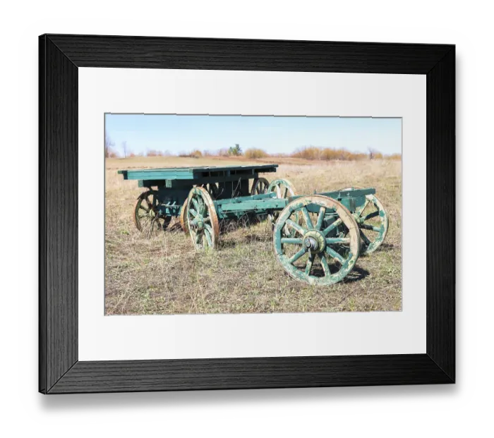 Framed Print : Country life. Old wooden carts without a horses stand at the field Framed Print : Country life. Old wooden carts without a horses stand at the field