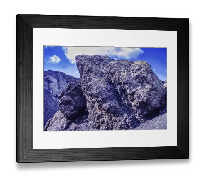 Framed Print : Impressive rock formation of volcanic rock rising against a blue sky Framed Print : Impressive rock formation of volcanic rock rising against a blue sky