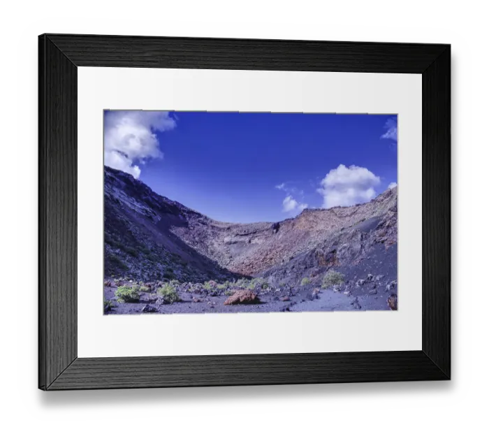 Framed Print : Impressive volcano crater with low vegetation under a blue sky