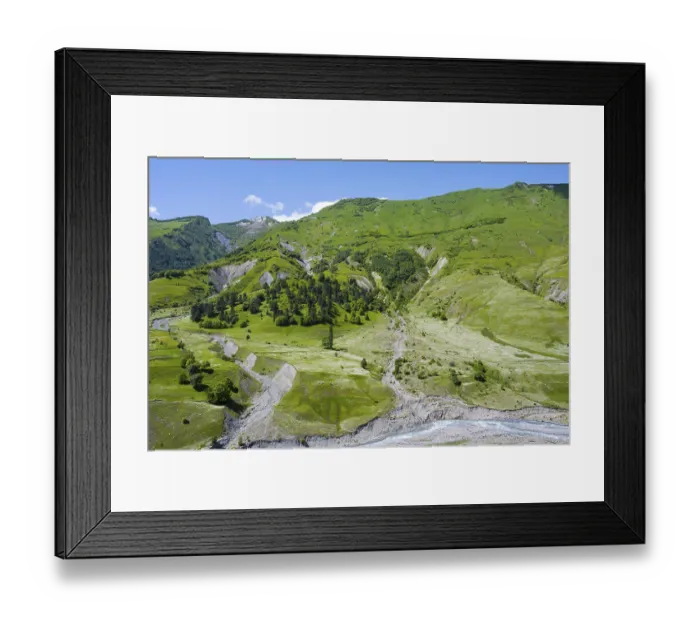 Framed Print : Green hills with a valley and river