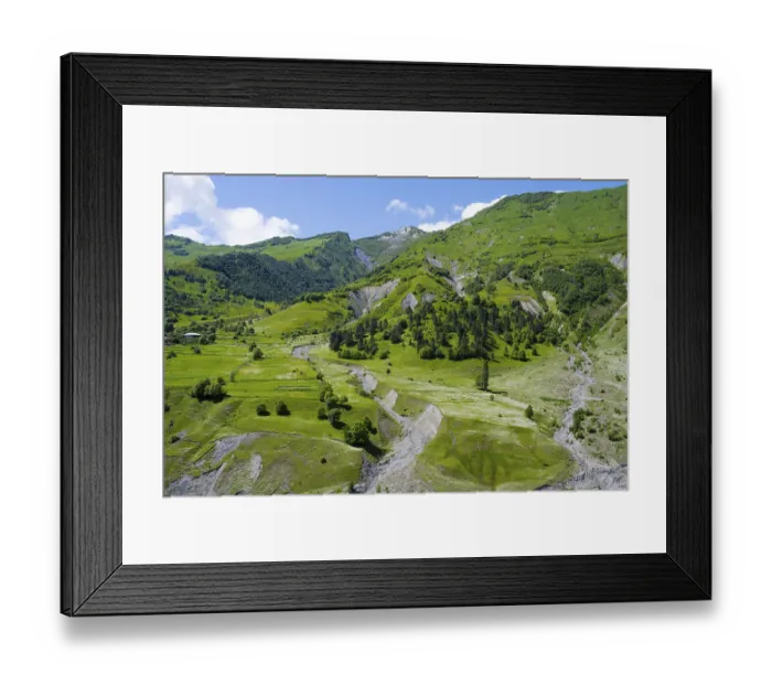 Framed Print : Idyllic hilly landscape with forest and meadows