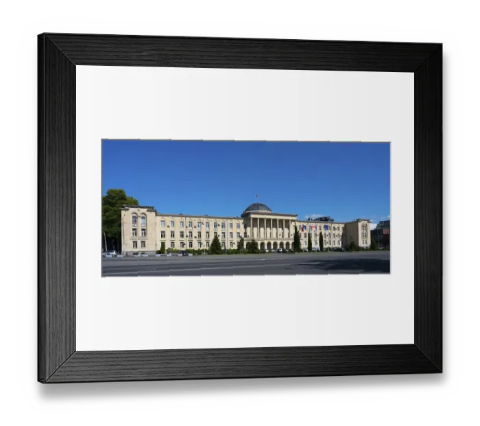Framed Print : Extensive classical building in panoramic view under bright blue sky