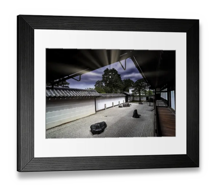 Framed Print : Zen garden with textured sand patterns and rocks surrounded by traditional Japanese architecture Framed Print : Zen garden with textured sand patterns and rocks surrounded by traditional Japanese architecture
