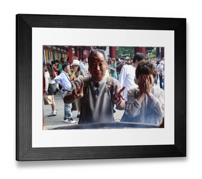 Framed Print : Visitors to Senso-ji Temple pose in front of a large fire bowl Framed Print : Visitors to Senso-ji Temple pose in front of a large fire bowl