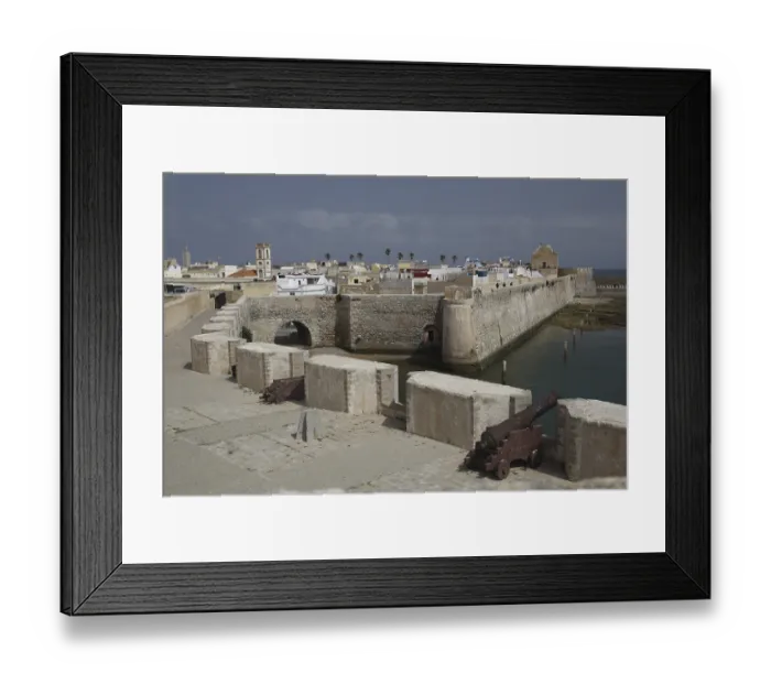 Framed Print : Massive fortress walls with cannons flanked by the sea