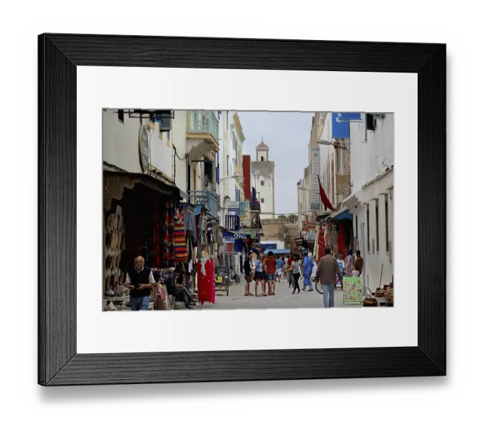 Framed Print : A busy street in the old town of Essouira with lots of shops and people Framed Print : A busy street in the old town of Essouira with lots of shops and people