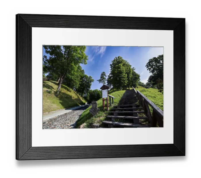 Framed Print : Wooden staircase leads through wooded hills in Veliuona under blue sky