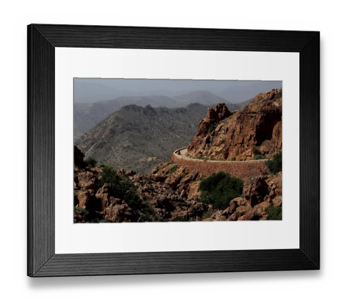 Framed Print : Winding road along the rocks in the mountains around Anergui
