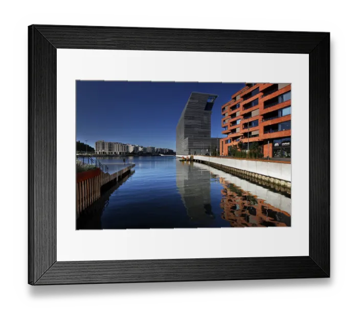 Framed Print : The Munch Museum is reflected in the clear water of Bjovika in Oslo