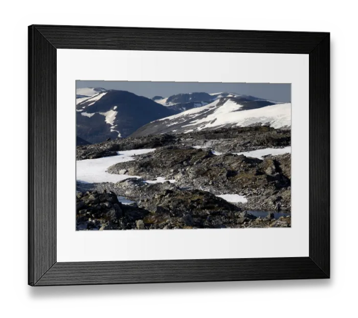 Framed Print : Snow-capped mountains and rocky landscape at Dalsnibba