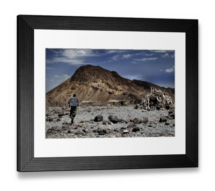 Framed Print : Wide landscape with mountains and boulders under blue sky in Ahmedela