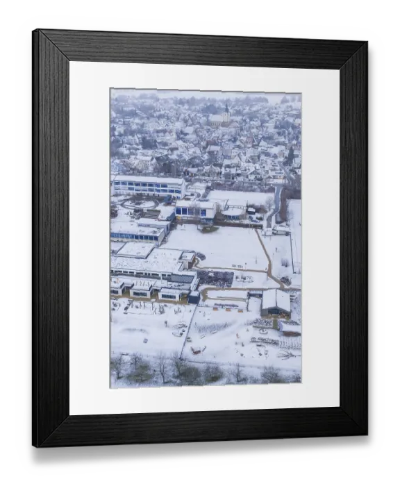 Framed Print : Village with snow-covered roofs and roads
