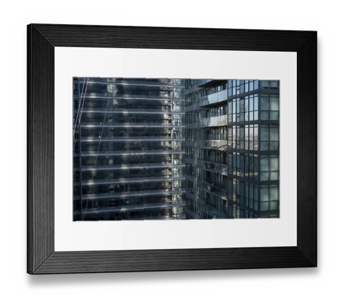 Framed Print : Close-up of urban high-rise with reflective glass Framed Print : Close-up of urban high-rise with reflective glass