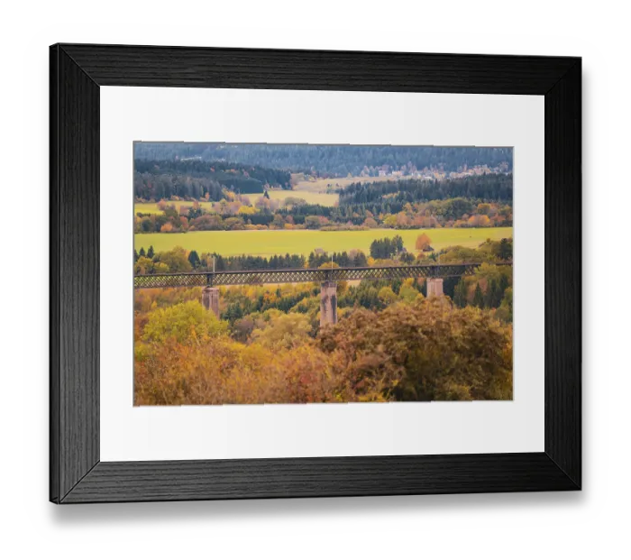 Framed Print : Bridge over an autumn landscape with colorful trees and meadows