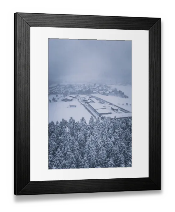 Framed Print : Snowy village on the edge of a forest under cloudy sky Framed Print : Snowy village on the edge of a forest under cloudy sky