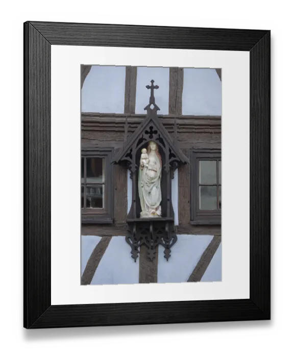 Framed Print : Madonna figure on a half-timbered facade Framed Print : Madonna figure on a half-timbered facade