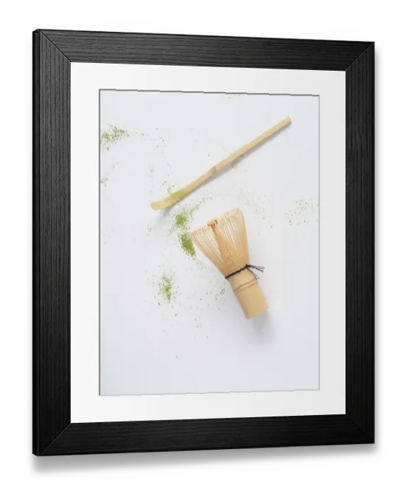 Framed Print : Matcha tea ceremony tools with scattered green powder on white background