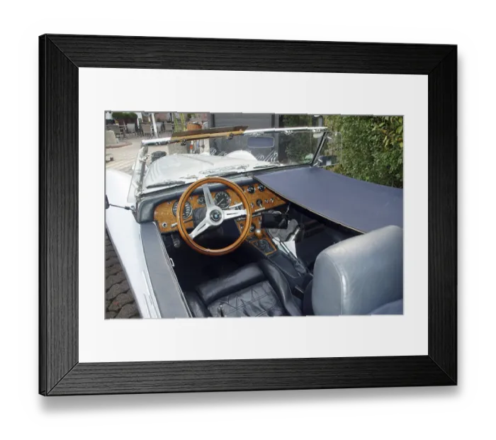 Framed Print : Detailed view of the interior of a classic convertible classic car with wooden steering wheel
