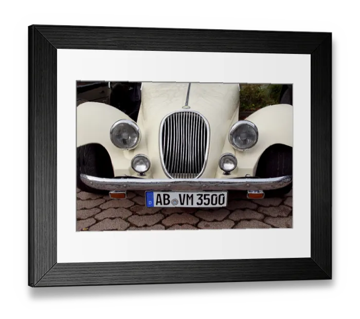 Framed Print : Front view of a classic white classic car with visible number plate Framed Print : Front view of a classic white classic car with visible number plate