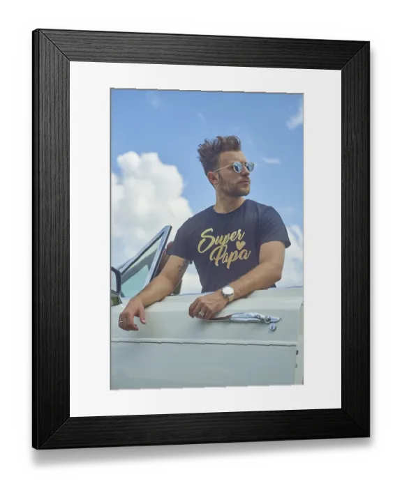 Framed Print : Man leaning on a white convertible with sunglasses against a bright blue sky with clouds Framed Print : Man leaning on a white convertible with sunglasses against a bright blue sky with clouds
