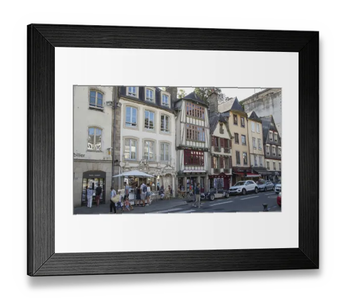 Framed Print : Vivid street scene with people sitting in cafes surrounded by traditional buildings