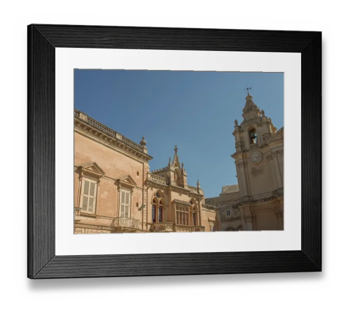 Framed Print : Baroque building facade with clock tower and windows against a clear sky