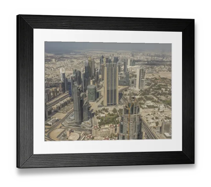 Framed Print : Bird's eye view of urban skyline with futuristic skyscrapers under clear sky