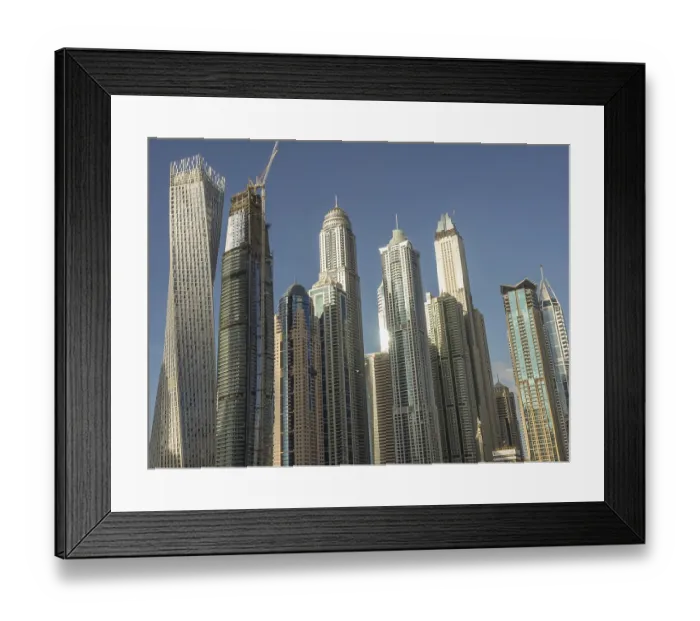 Framed Print : Futuristic skyline with a series of skyscrapers under clear skies