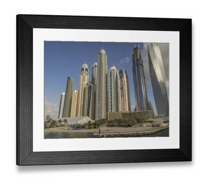 Framed Print : Modern skyscrapers on harbor with blue sky and water