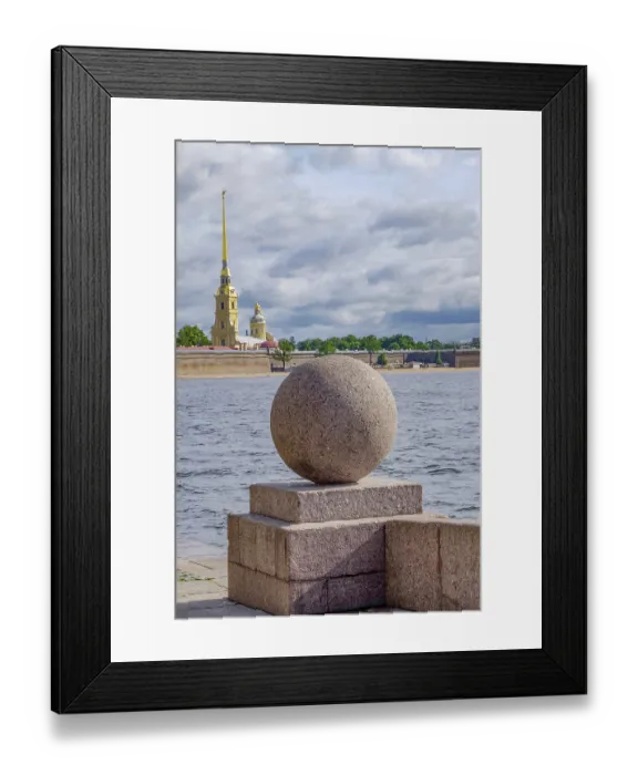 Framed Print : Stone ball on the river with cathedral in the background under a cloudy sky Framed Print : Stone ball on the river with cathedral in the background under a cloudy sky