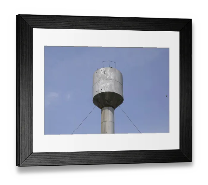 Framed Print : Silver Water Tower among green grass and trees Framed Print : Silver Water Tower among green grass and trees