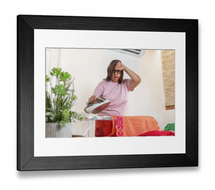 Framed Print : Woman feeling exhausted from heat and tedious domestic work