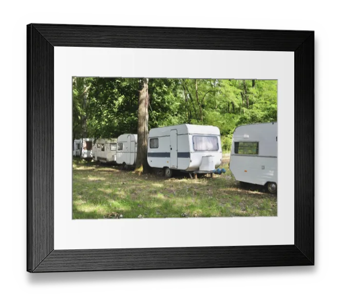 Framed Print : Outdoor forest trailer camp caravan cars behind trees