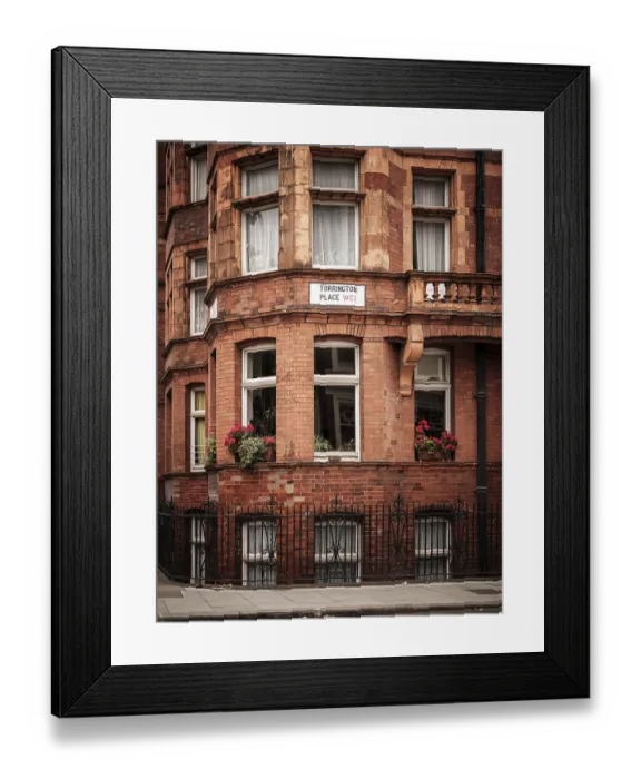 Framed Print : Red brick building with flower boxes on windows in the city in Greater London