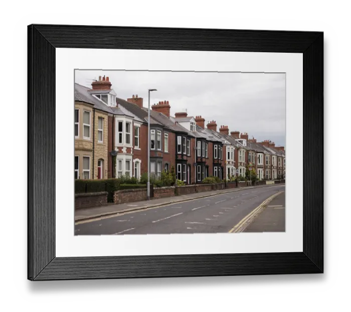 Framed Print : A quiet residential street featuring a row of traditional terraced houses in Blyth