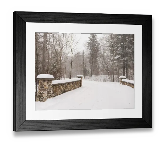 Framed Print : A snowy path through a serene forest with a stone bridge in London