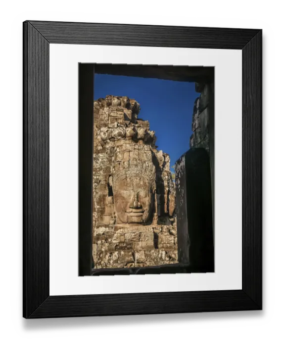 Framed Print : Huge stone face sculpture in the Bayon Temple in the Angkor temple complex near Siem Reap