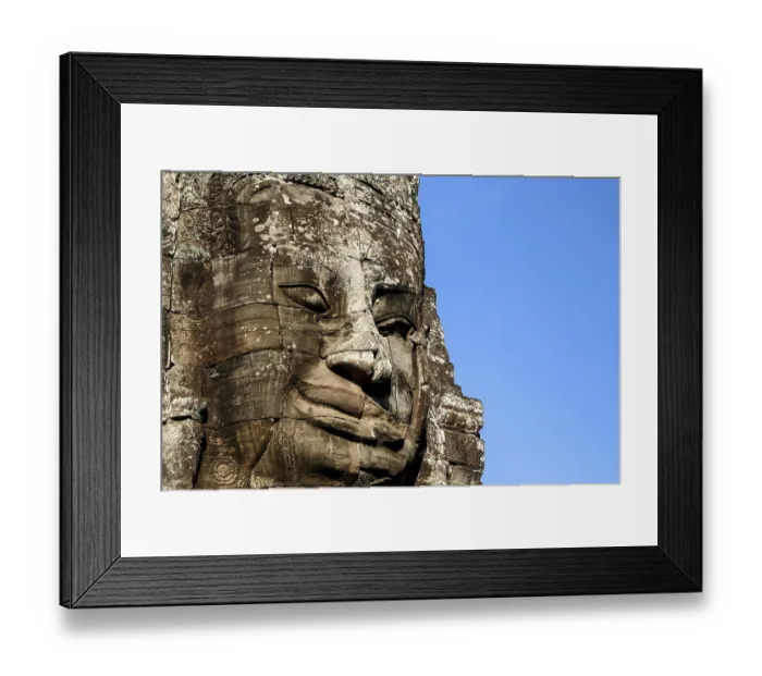 Framed Print : Stone Face sculpture in Angkor Wat temple near Siem Reap in Cambodia