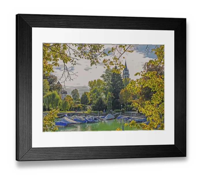 Framed Print : Boat harbour and parish church of St