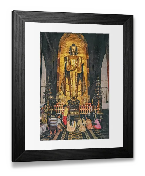 Framed Print : Believers standing in front of a large Buddha in Ananda Temple in Bagan