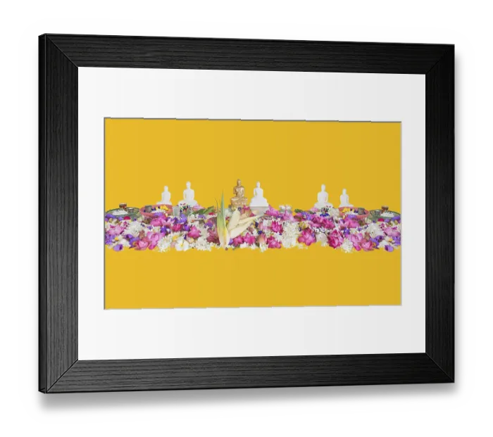 Framed Print : Ceremonial flowers and buddha figurines isolated on yellow background